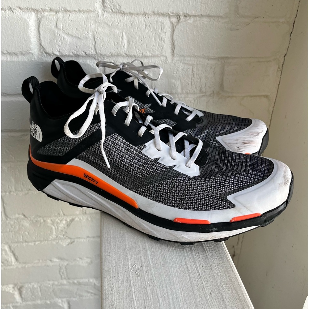 The North Face Black and White Sneakers with Orange Accents